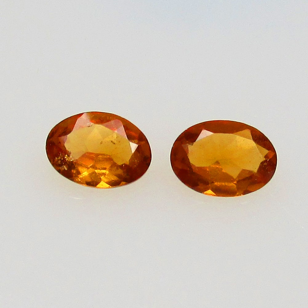 1.35 Ctw Natural Hessonite Garnet Oval Pair: No Reserve! Title: 1.35 Ctw Natural Hessonite Garnet Oval Pair Stone Clarity: VVS Gemstones: Natural Hessonite Garnet Carat Weights: 1.35 Size/Dimensions: 7.00 x 5.00 x 2.30 mm / 2 Pc's Additional Inf
