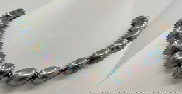 12x14mm Rainbow Peacock Tahitian Pearls - Necklace: Title: 12x14mm Rainbow Peacock Tahitian Pearls - Necklace Description: A luxury pearl necklace, made with drop shaped Tahitian pearls, and completed with an elegant silver clasp. Tahitian pearls are c