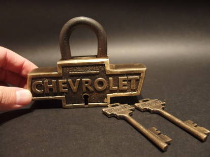 Brass & Iron Trunk Chevrolet Chevy Lock Padlock: 4 3/4" Long x 3 1/2" Tall 1" Thick Just wonderful heavy duty antique reproduction iron padlock with keys. Fully functional, looks great on an old truck or chest! Reserve: $40.00 Shipping: Domestic: Fl