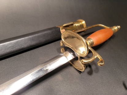 French Cutlass Hanger Sword French Indian War & Rev War: 43" Long with scabbard 38" overall 30 1/2" V blade 4" Wood handle Similar to the replica Antique English Hanger we offer, this piece is the French Hanger Replica c1730-1750 wood handle, solid brass so