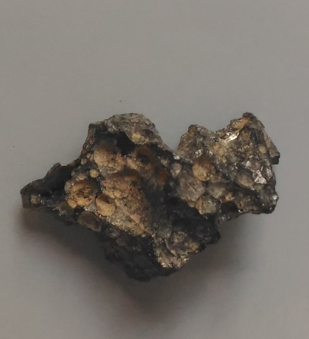 Philippinite Tektite - From Meteorite Impact: Title: Philippinite Tektite - From Meteorite Impact Origin: Anda, Cabarruyan Isl. Pangasinan, Luzon, Philippinines Size: 1.8x1.2x0.8 cm / 1.01 gram small hackly structured philippinite tektite with so