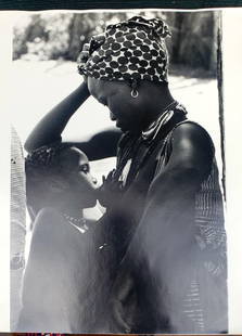 Roy DeCavara Photograph UnSigned African art 1960 1970 woman breast feeding: Roy Decavara (1919-2009). Famous Photographer . Best known for his photographs of Harlem. I purchased several pieces from a collection. UnSigned on the back. Photos were preserved in a album so kept