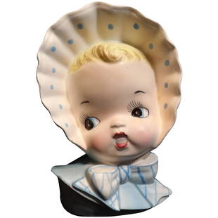 Ucagco Baby Head Vase with Bonnet and Blue Striped Bow: This Ucagco Baby Head Vase with Bonnet and Blue Striped Bow is almost impossible to find, I only found one like it in my research. It is in excellent condition. NO chips, cracks, or crazing – does