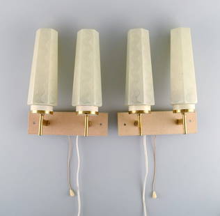 Scandinavian designer. A pair of double brass wall lamps with glass shades. Mid-20th century.: Title: Scandinavian designer. A pair of double brass wall lamps with glass shades. Mid-20th century. Description: Scandinavian designer. A pair of double brass wall lamps with glass shades. Mid-20th c