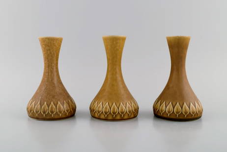 Jens H. Quistgaard (1919-2008) for Bing & Grøndahl / Nissen Kronjyden. Three Relief vases in glazed: Title: Jens H. Quistgaard (1919-2008) for Bing & Grøndahl / Nissen Kronjyden. Three Relief vases in glazed stoneware. Beautiful glaze in mustard yellow shades. 1960s. Description: Jens H. Quistga