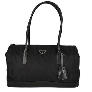 PRADA unisex shoulder bag in nylon and black leather: Title: PRADA unisex shoulder bag in nylon and black leatherMaterials: NylonMeasurements/Size: DIMENSIONS: L: 36 cm - H: 21 cm - W: 11 cm - Handles 22 cmDescription: (5181B168). Prada unisex shoulder