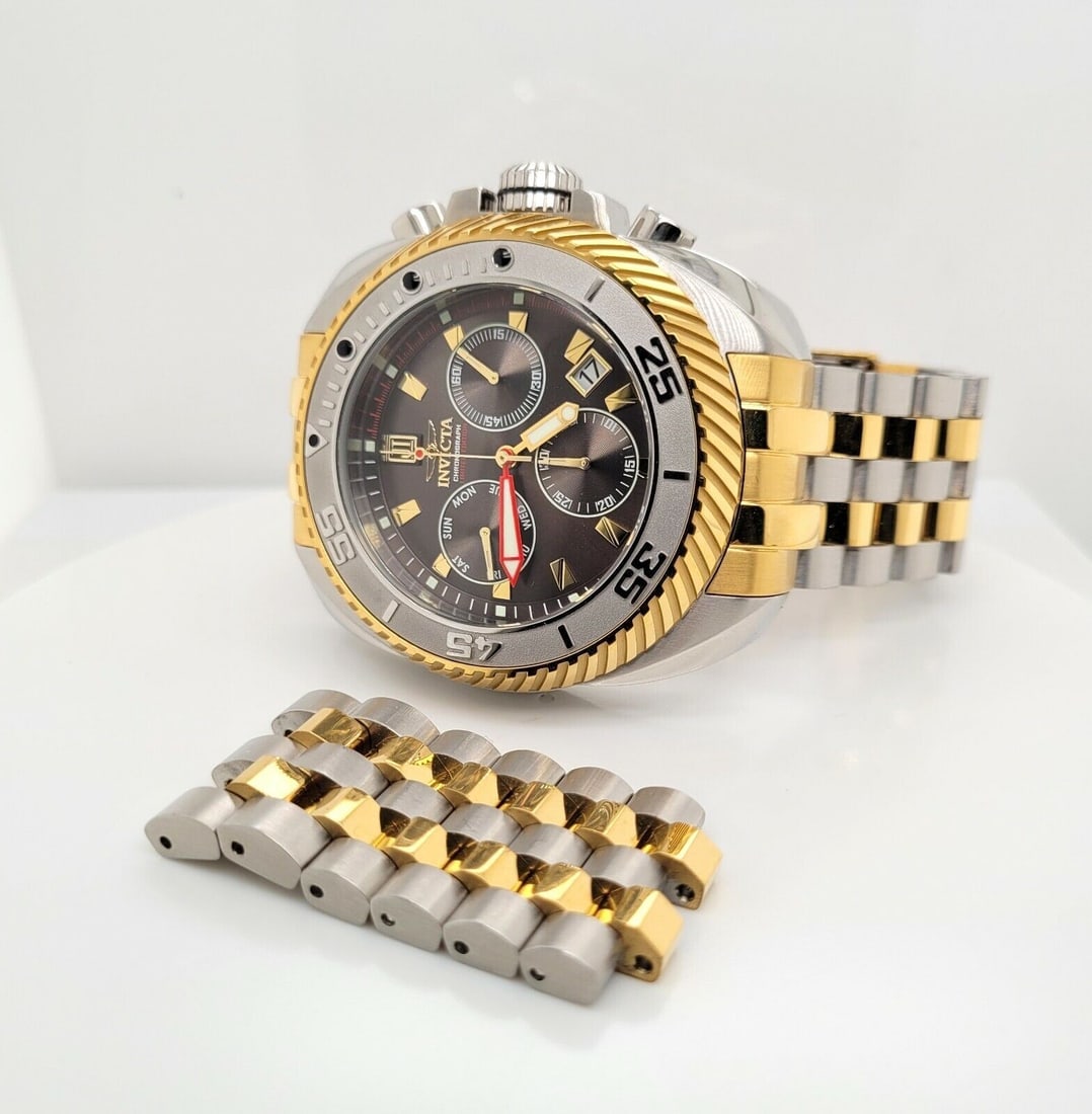 Designer Invicta 30205 Stainless Steel Gold Plated Jason Taylor Quartz Watch: Invicta 30205 Stainless Steel Gold Plated Jason Taylor Quartz Watch Model no. 30205 Stainless steel case and bracelet Case measures 49mm x 57mm including lugs Rotating bezel Crown measures 8.7mm Watch