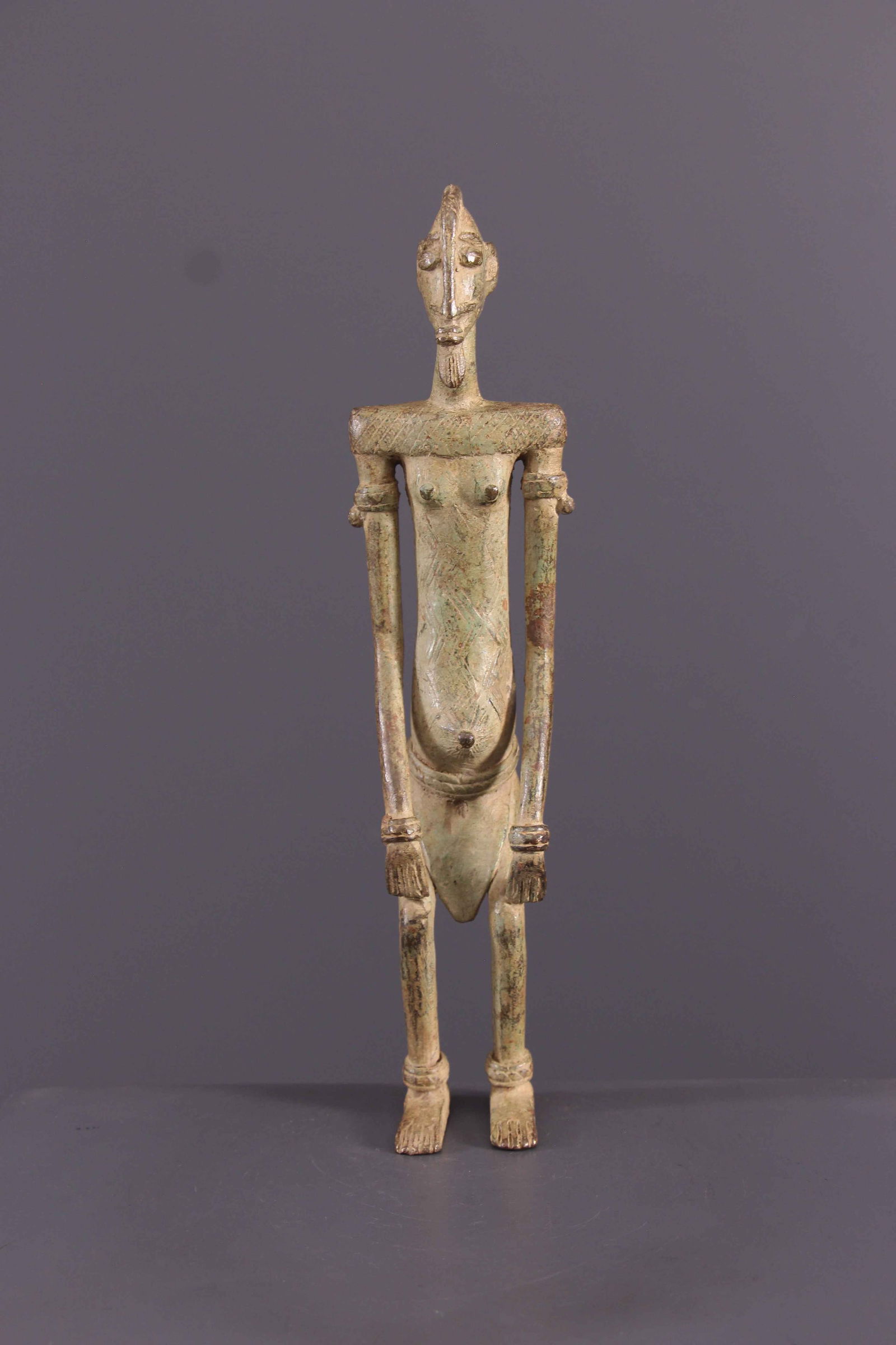 Dogon statue - Mali - African Art Tribal Art: Title: Dogon statue - Mali - African Art Tribal Art Description: Dogon blacksmiths form an endogamous caste among the Dogon called irim. They now produce weapons, tools, and also work with wood. "Mast