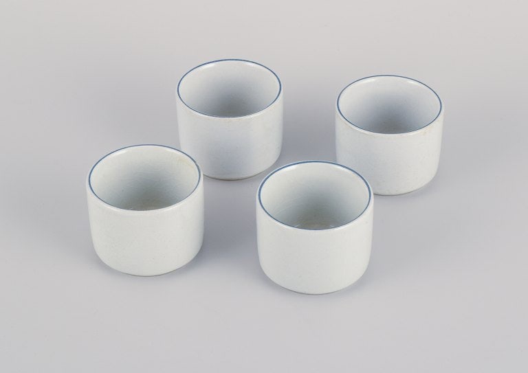 Aluminia, four Blåkant egg cups.: Aluminia, four Blåkant egg cups. Mid 20th century. Perfect condition. Marked. First factory quality. Dimensions: H 3.5 x D 4.5 cm. Reserve: $140.00 Shipping: Domestic: Shipping rates are determin