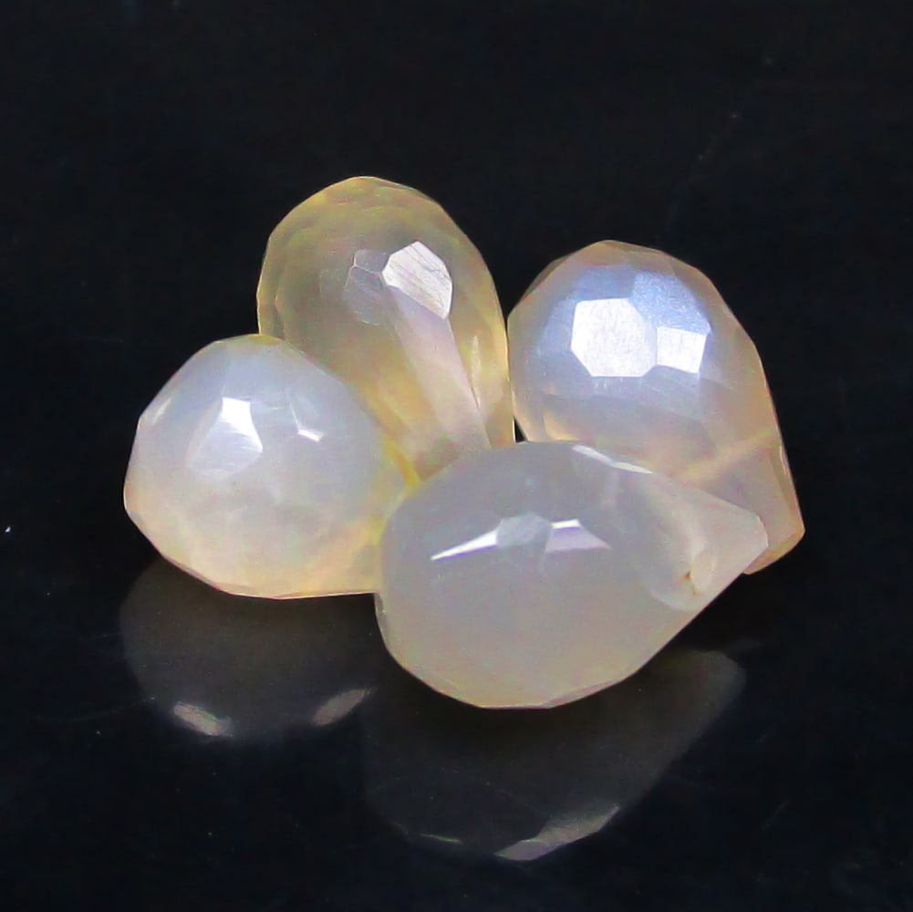 7.71 Ctw Natural 4 Moonstone Pear Drop Beads: No Reserve! Title: 7.71 Ctw Natural 4 Moonstone Pear Drop Beads Stone Clarity: Translucent Gemstones: Natural Moonstone Beads Carat Weights: 7.71 Size/Dimensions: 9.3x6.2 - 9.7x6.0 mm / 4 Pc's Additio