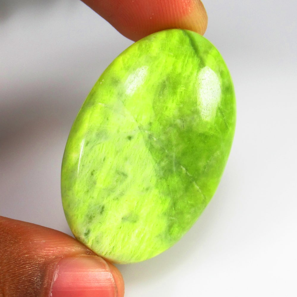 59.23 Ct - Natural Lemon Chrysoprase: No Reserve! Title: 59.23 Ct - Natural Lemon Chrysoprase Additional Information: Gemstone Gemstones: Chrysoprase Carat Weights: 59.23 Size/Dimensions: 40.0 x 26.0 x 7.5 mm Additional Information: Piece