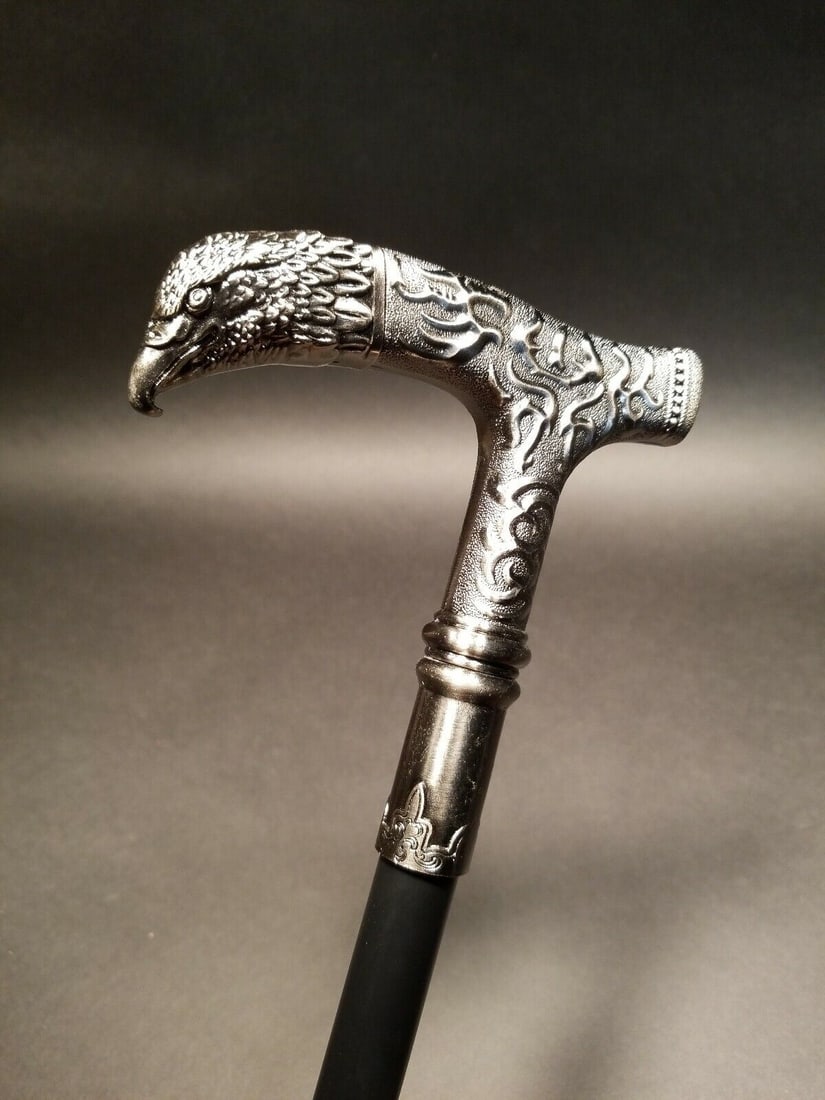 35" Eagle Metal Walking Stick Cane: 35" long Such a neat antique style walking cane. As you can see the all metal cane has a highly detailed eagle head handle with a hollow metal shaft to a rubber foot. Nice heavy quality! Reserve: $30.