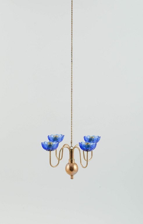 Gunnar Ander for Ystad Metall. Chandelier for four candles in brass and mouth-blown art glass shaped: Title: Gunnar Ander for Ystad Metall. Chandelier for four candles in brass and mouth-blown art glass shaped like flowers. Description: Gunnar Ander for Ystad Metall. Chandelier for four candles in bra