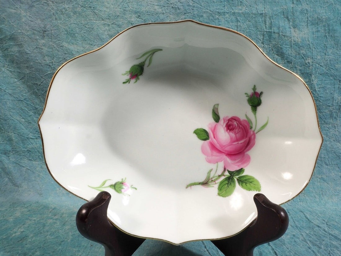 MEISSEN Pink Rose Candy Oval Bowl Crossed Swords Ruffled Rim Gold GERMANY: This is a beautiful Candy/Nuts/Snack Oval Bowl made by Meissen. The bowl is in the famous pink Rose pattern that is dated back to early 19th century. The bowl is decorated with lovely hand painted pin