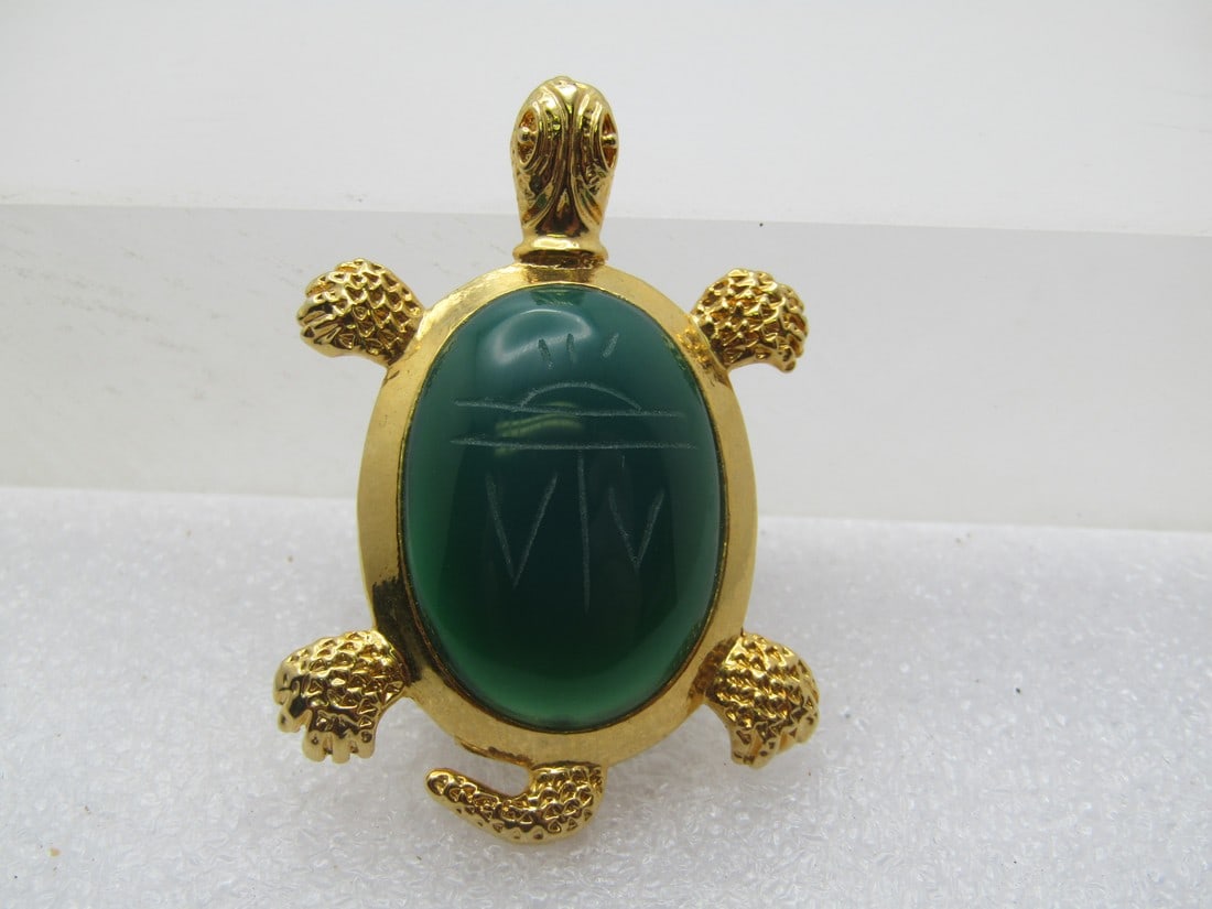 Vintage Green Scarab Turtle Brooch/Pendant, 1980's: Vintage Green Scarab Turtle Brooch/Pendant , 1980's. Gold tone turtle with textured feet and tail with lined details in the head. It is appx. 1.75" tall and 1-1/8" wide. The scarab is a dark green chr
