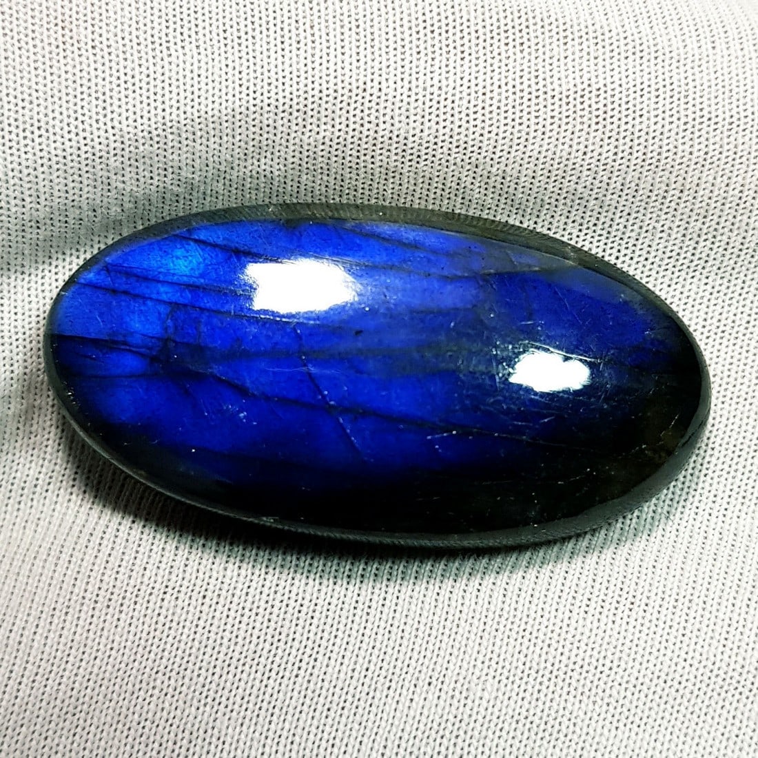 44.89 Ctz Natural Blue Labradorite: No Reserve! Title: 44.89 Ctz Natural Blue Labradorite Color/Clarity: Bluish / Semi Transparent Gemstone: Labradorite Carat Weights: 44.89 Size: 35.80 x 18.30 x 7.50 Additional Information: Oval Caboch