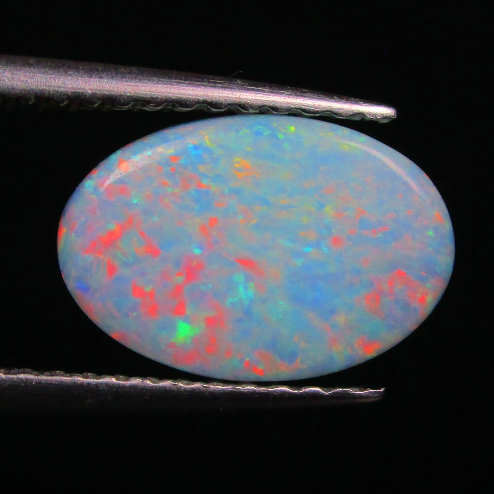 2.72 Ctw Natural Australian Doublet Opal Oval Cabochon: No Reserve! Title: 2.72 Ctw Natural Australian Doublet Opal Oval Cabochon Stone Clarity: Opaque Gemstones: Natural Australian Opal Carat Weights: 2.72 Size/Dimensions: 11.00 x 7.40 x 4.00 mm Additiona