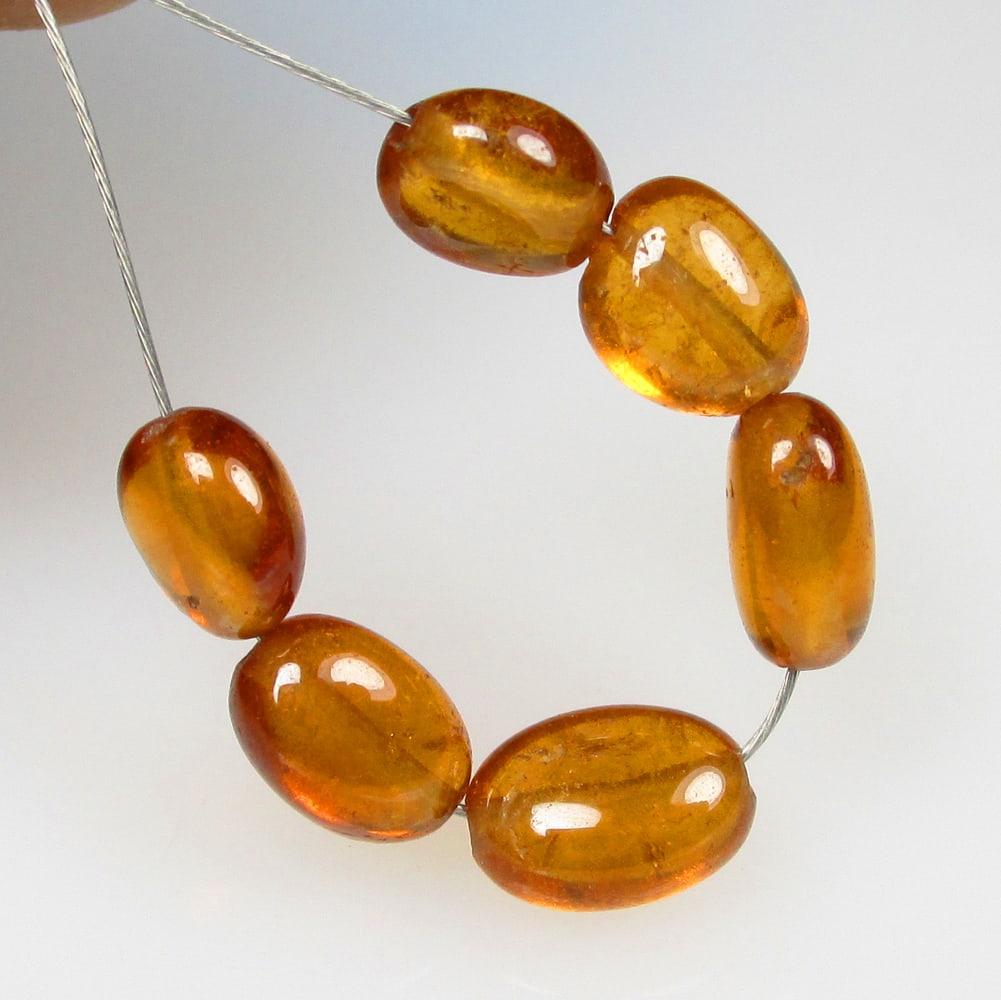 6.17 Ctw Natural Hessonite Garnet Dumble Beads: No Reserve! Title: 6.17 Ctw Natural Hessonite Garnet Dumble Beads Stone Clarity: Transparent Gemstones: Natural Hessonite Garnet Beads Carat Weights: 6.17 Size/Dimensions: 4.6x3.1 - 5.0x3.3 mm / 6 Pc'