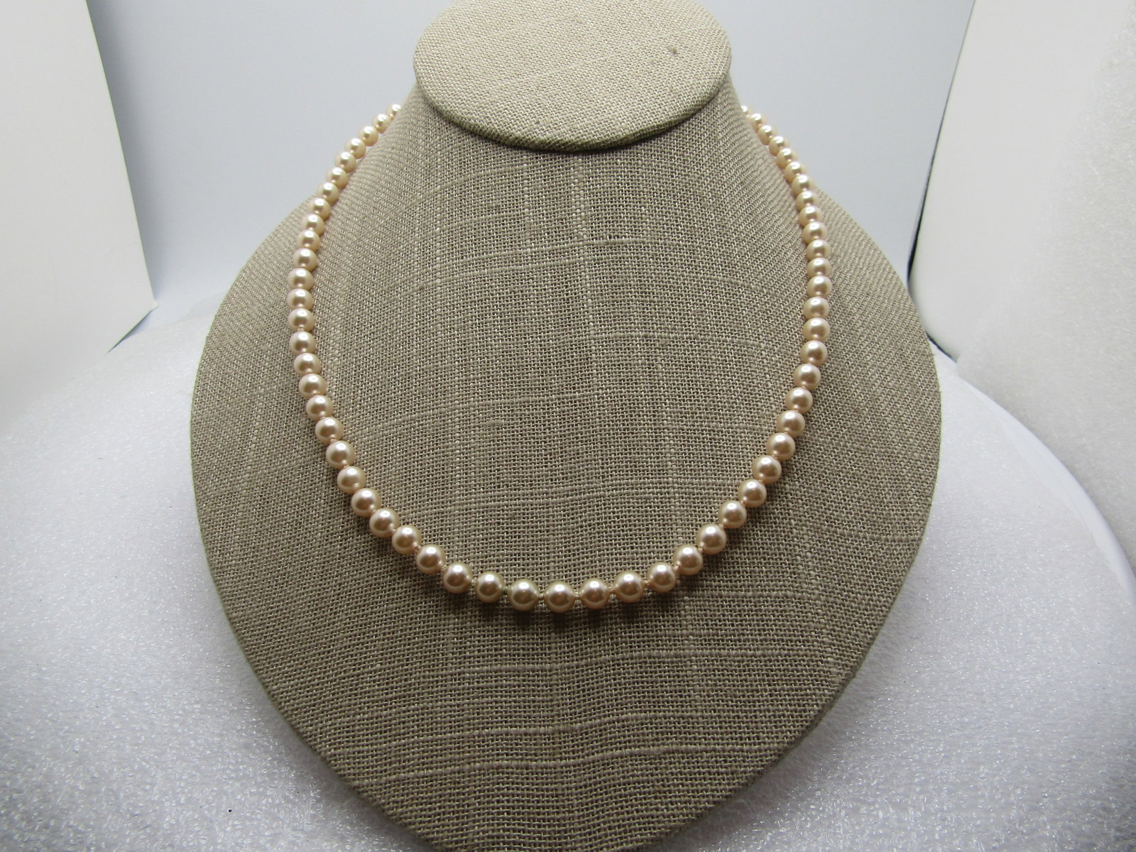 Vintage 5mm Pearl Necklace, Sterling Clasp, 18", 1950's-1960's: Vintage 5mm Pearl Necklace, Sterling Clasp, 18", 1950's-1960's. White cultured pearls, knotted between in very good condition. The clasp is marked sterling . The hook that slides into the filigree cla