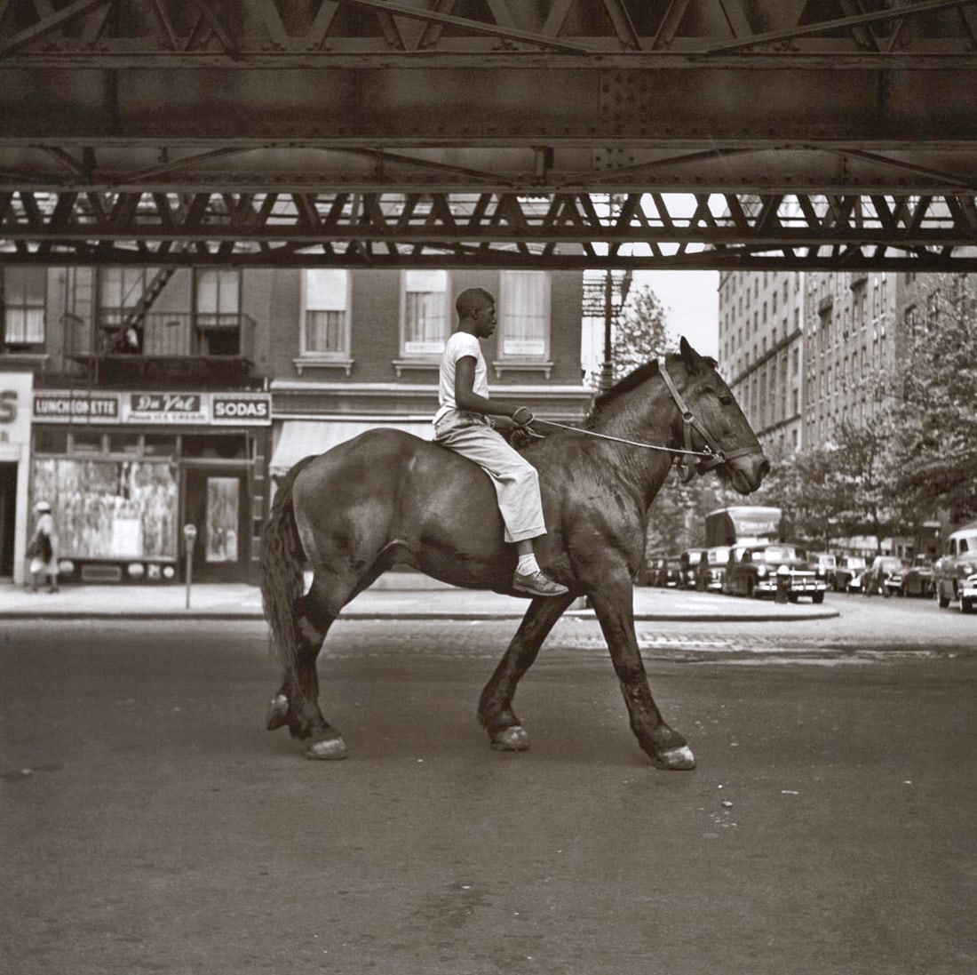 VIVIAN MAIER - Untitled (Boy on Horse): Artist: VIVIAN MAIER Print Title: Untitled (Boy on Horse) Medium: Duotone Photolithograph Printed 2010’s in China Image size (inches) approx. 9 x 9” Additional Information: COA included Re