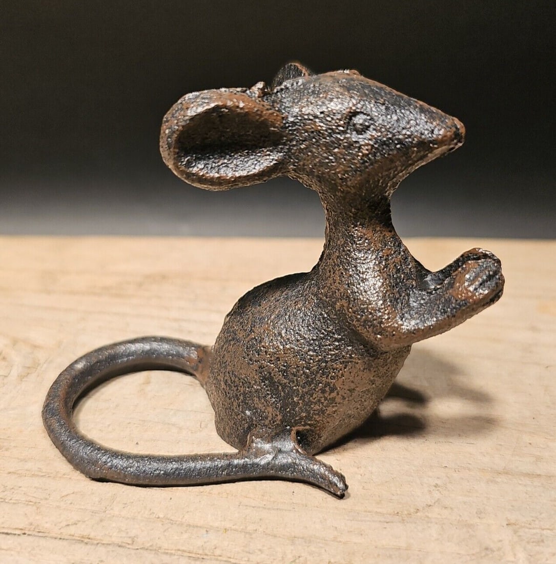 Cast Iron Mouse: 3" Tall x 4" Long x 2 1/2" Wide Nice Reproduction solid cast iron mouse statue. This mouse is much thicker, and heavier then other similar ones we have seen. Makes a great accent piece indoor or out.