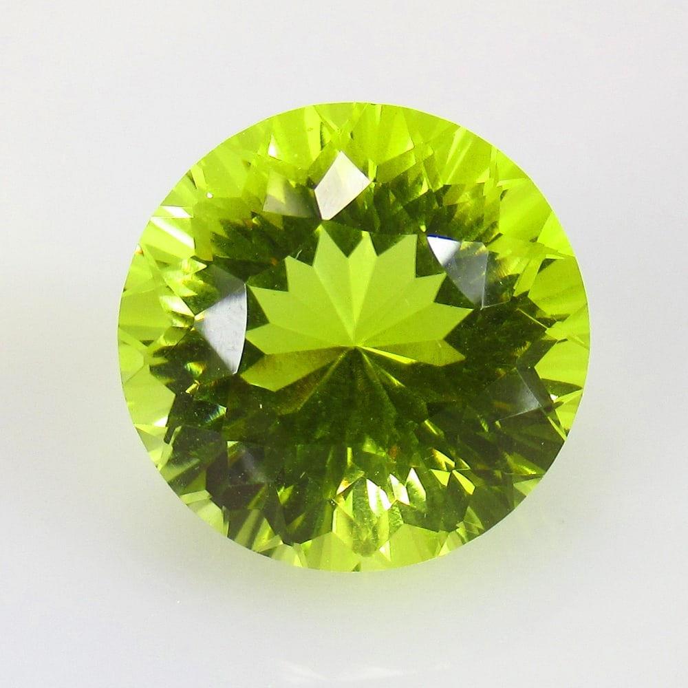 14.91 Ctw Natural Lemon Quartz Round Cut: Title: 14.91 Ctw Natural Lemon Quartz Round Cut Stone Clarity: VVS Gemstones: Natural Lemon Quartz Carat Weights: 14.91 Size/Dimensions: 16.00 x 16.00 x 11.80 mm Additional Information: Good Luster / 