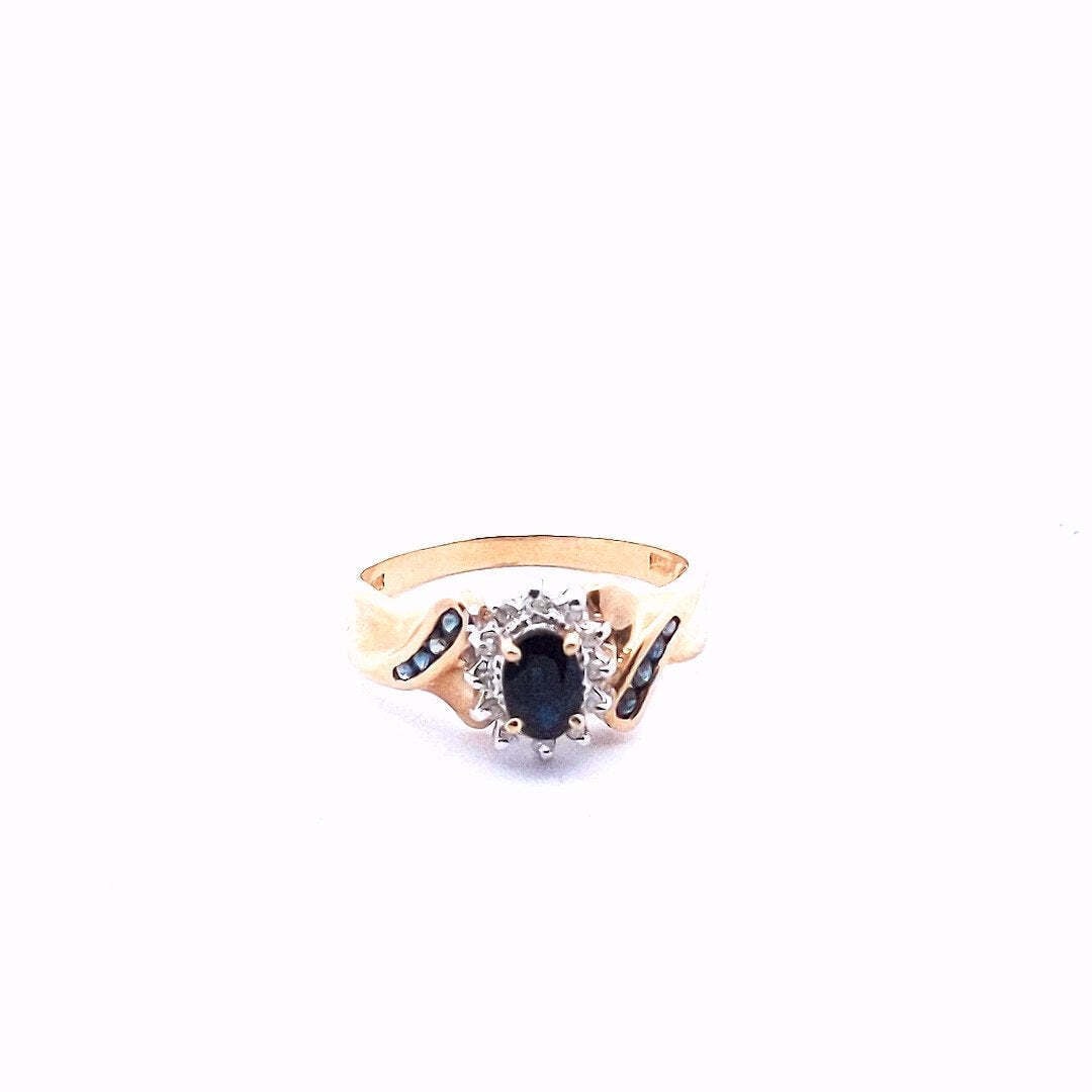 Vintage $460 14K Yellow Gold Diamond Sapphire Ring: Title: Vintage $460 14K Yellow Gold Diamond Sapphire Ring Description: Vintage 14K Yellow Gold Diamond Sapphire Ring Ring size 8-1/4 Ring contains 12 single cut diamonds 0.12 total carat weight Diamon