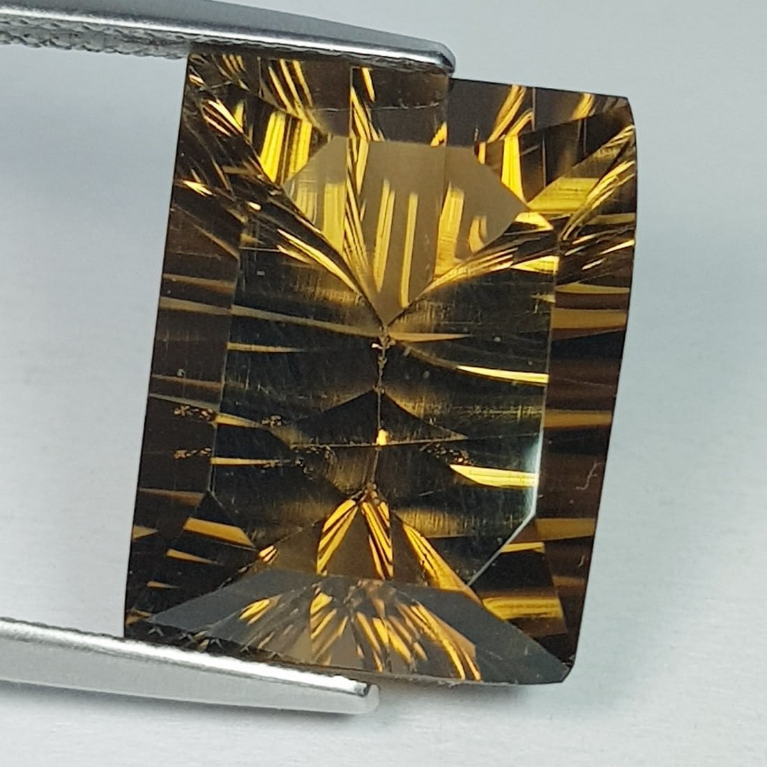 14.63 Ctz "Master Collection" Concave Cut Natural Honey Quartz: No Reserve! Title: 14.63 Ctz "Master Collection" Concave Cut Natural Honey Quartz Color/Clarity: Honey / IF-VVS Gemstones: Quartz Carat Weight: 14.63 Size/Dimensions: 16.60 x 12.80 x 10.00 Additional 