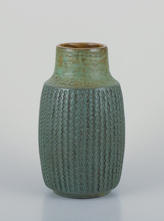 Mari Simmulson (1911-2000) for Upsala Ekeby, Sweden. Ceramic vase with a geometric pattern in a: Mari Simmulson (1911-2000) for Upsala Ekeby, Sweden. Ceramic vase with a geometric pattern in a greenish glaze. Approximately 1960. Model number 6080. In perfect condition. Marked. Dimensions: H 20.0