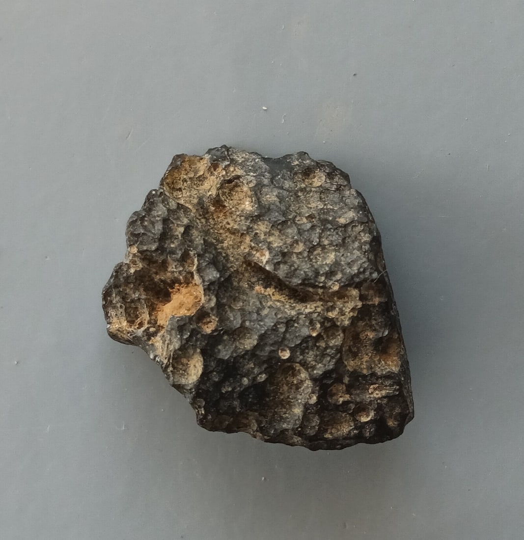 Philippinite Tektite - From Meteorite Impact: Title: Philippinite Tektite - From Meteorite Impact Origin: Anda, Cabarruyan Isl. Pangasinan, Luzon, Philippinines Size: 2.1x1.6x0.9 cm / 3.40 gram Description: flattened philippinite tektite with goo