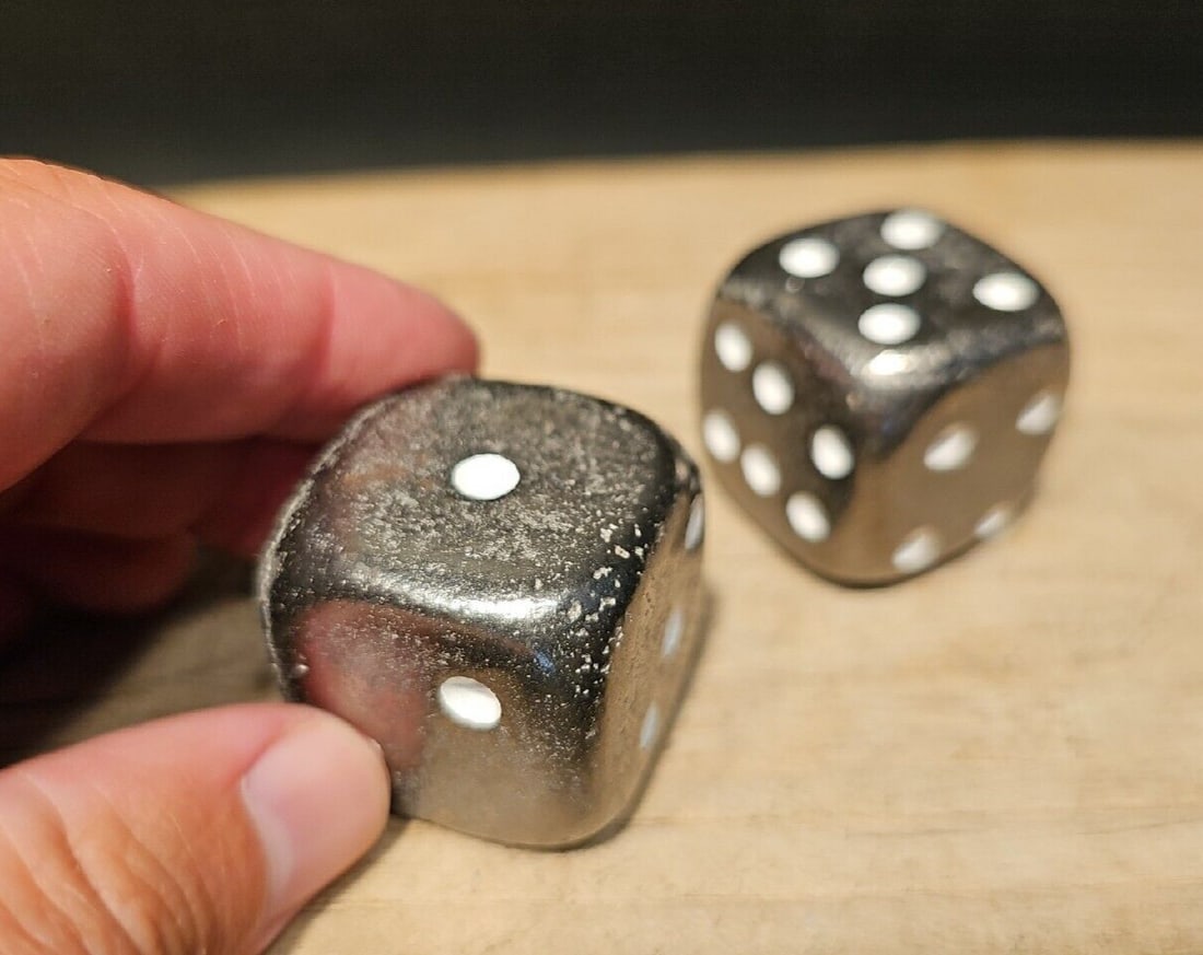 2 1 1/4" Iron Dice: 2 1 1/4" Dice Introducing the extraordinary Wonderful Reproduction Set of Diceâ€”a testament to the artistry and craftsmanship of handmade dice. Each die in this set bears the charming signs of b