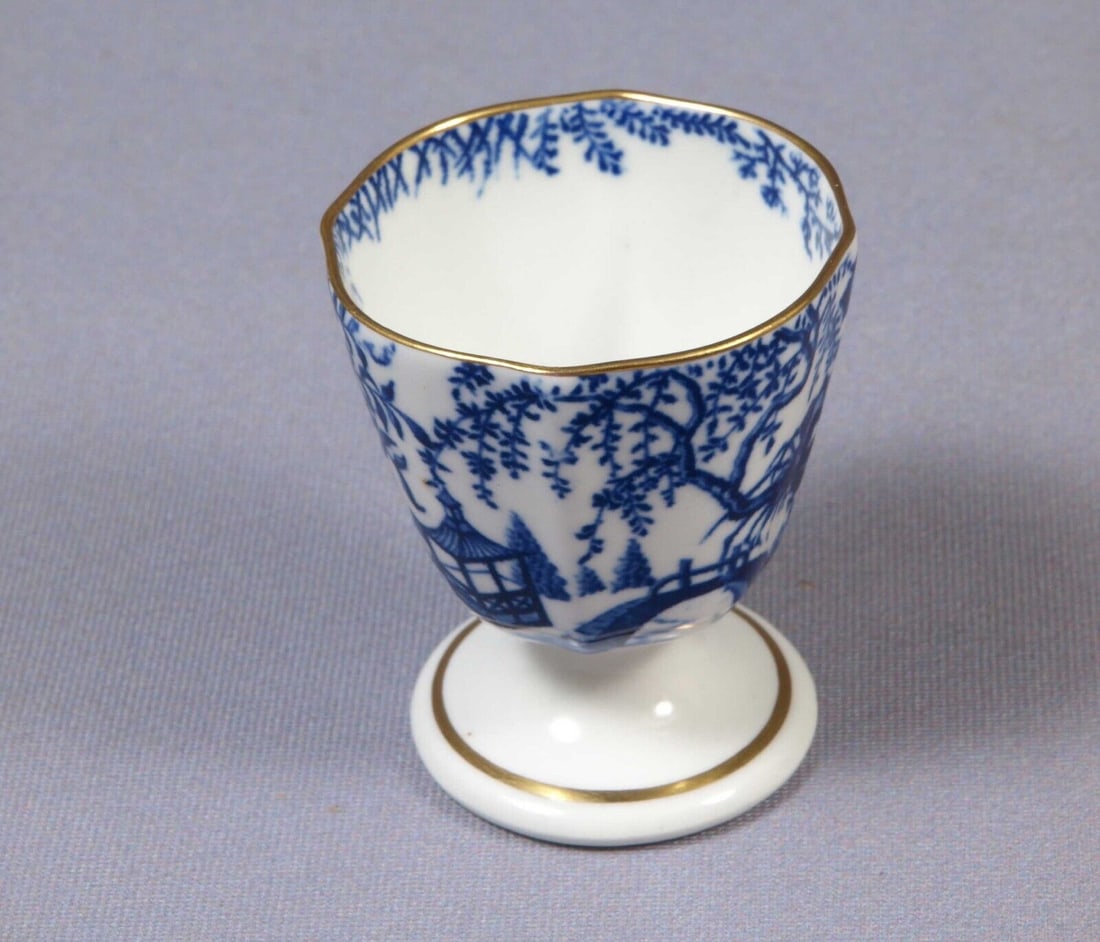 Royal Crown Derby Blue Mikado EGG CUP England Made in 1917: This beautiful, Bone china egg cup is made by Royal Crown Derby in their famous Mikado collection. The Mikado pattern was designed in 1894 by Royal Crown Derbyâ€™s art director, Thomas Amos Reed.