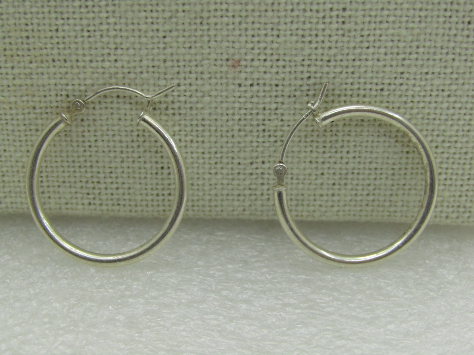Vintage Sterling Silver 1" Hoop Earrings, Pierced, 2mm: Vintage Sterling Silver 1" Hoop Earrings, Pierced, 2mm tubular round hoops that are appx. 1" tall and wide with a hinged locking post that is slightly rounded. Very good condition. Not signed by the m