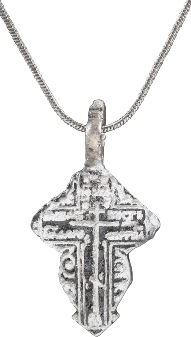 EASTERN EUROPEAN CHRISTIAN CROSS NECKLACE.: 17th-18th Century, Ukrainian, Orthodox rite. Silvered bronze. Over 1 3/8” total height. Raised border delineating the cross with broad beams, the cross beam above center and enclosing a stick cr