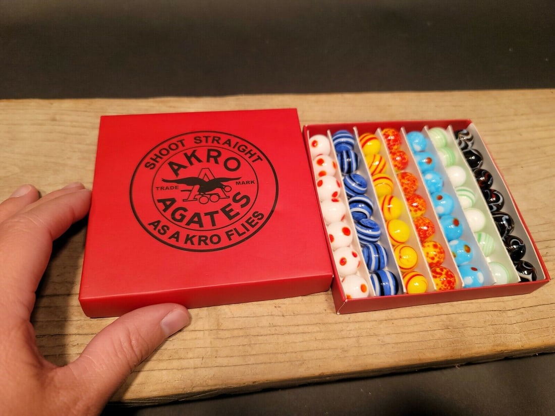 Akro Agates Marble set w Box: 5/8" Marbles as shown. Wonderful reproduction "fantasy box" with modern glass marbles . Great Set! Reserve: $25.00 Shipping: Domestic: Flat-rate of $7.00 to anywhere within the contiguous U.S. Interna