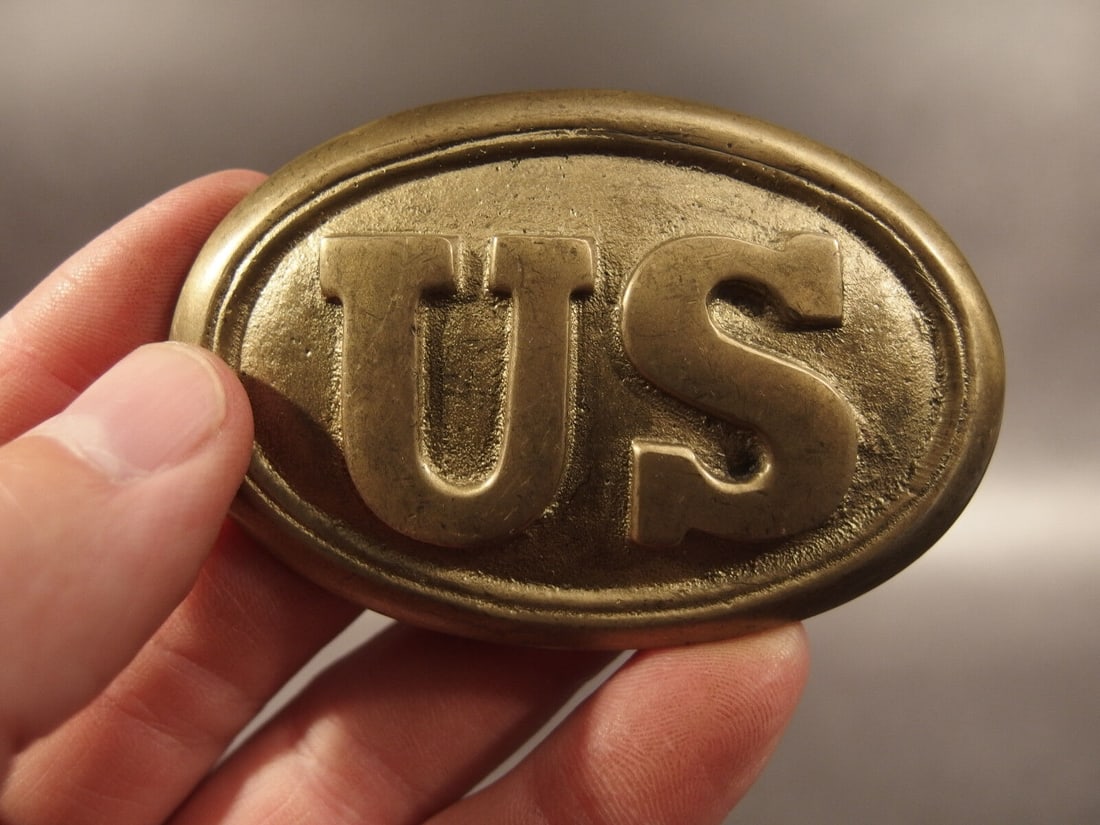 Civil War Union Soldier US Belt Buckle Plate SOLID Brass: 3 1/8" Wide x 2 1/8" High This all solid brass replica belt plate will surely make you wonder its age. It is made to look just like the antique. The face of this plate has a very pleasing antique bras