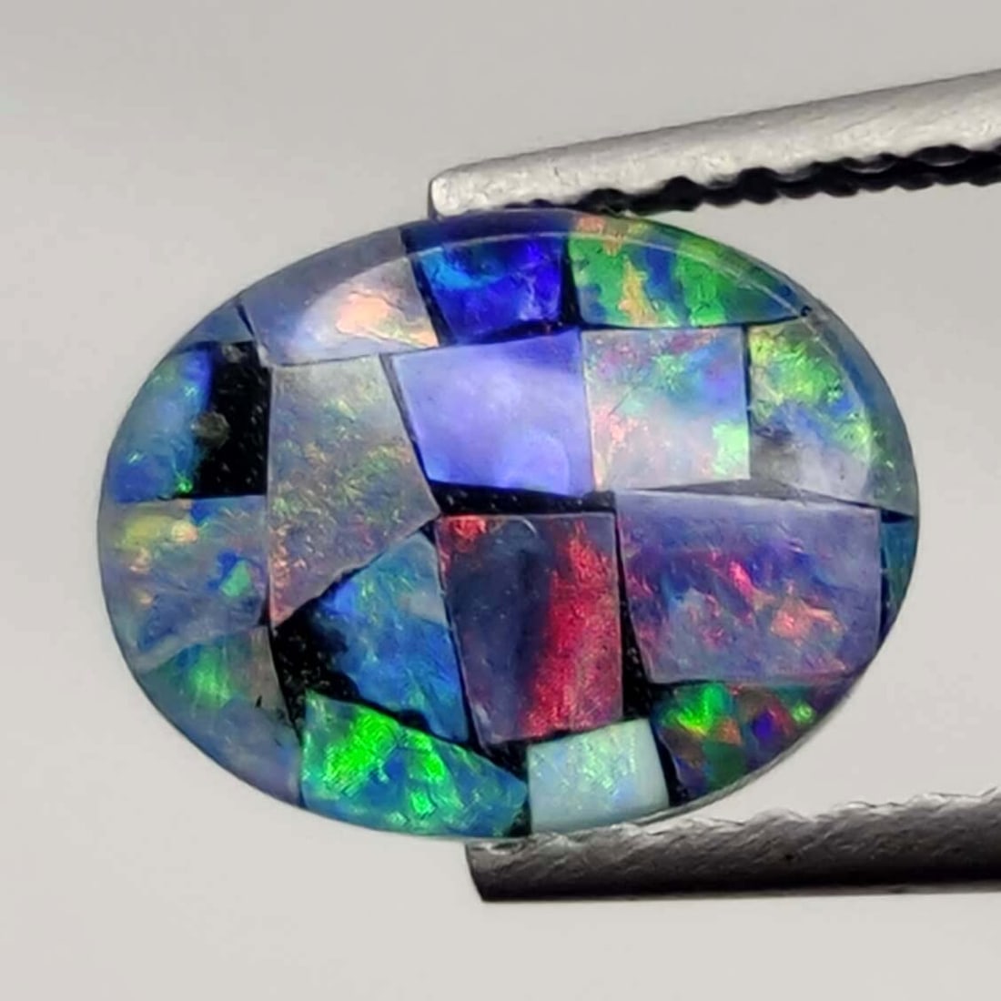 1.55 ct Australian Triplet Mosaic Opal: No Reserve! Title: 1.55 ct Australian Triplet Mosaic Opal Description: Gemstones: Australian Doublet Opal Carat Weights: 1.55 ct Size/Dimensions: 9 X 7 mm Materials &Techniques:Doublet Opal Shipping: