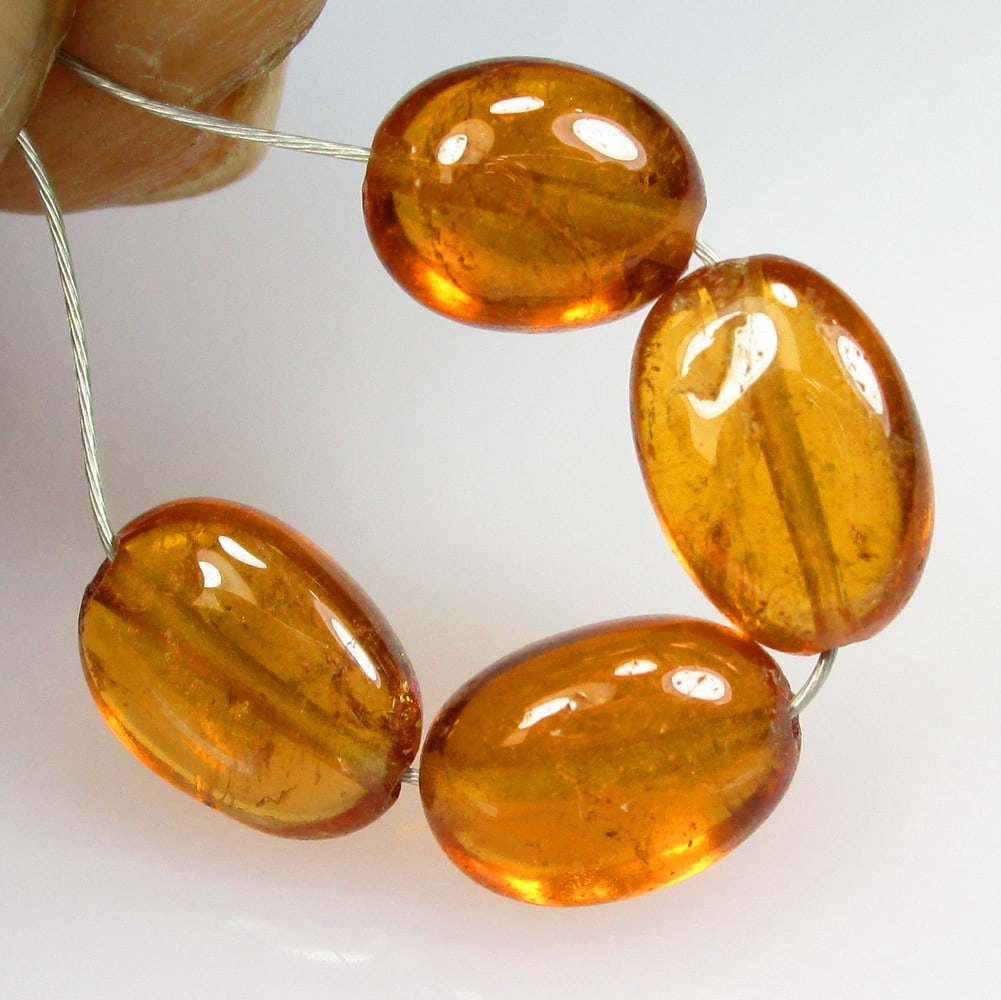 6.15 Ctw Natural 4 Hessonite Garnet Dumble Beads: No Reserve! Title: 6.15 Ctw Natural 4 Hessonite Garnet Dumble Beads Stone Clarity: Transparent Gemstone:Natural Hessonite Garnet Beads Carat Weight: 6.15 Size/Dimensions: 5.3x3.5 - 5.5x3.8 mm / 4 Pc's