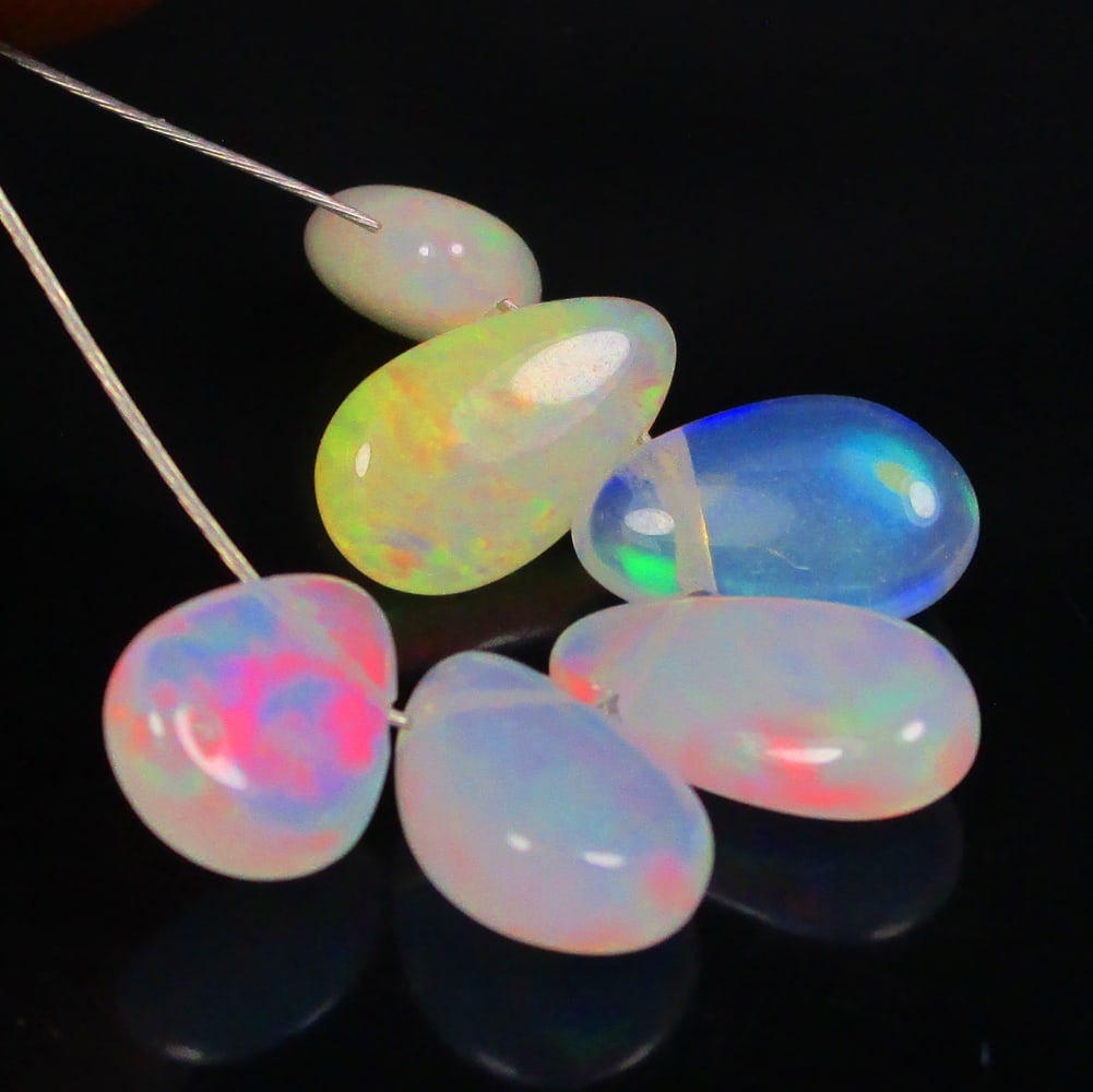 4.08 Ctw Natural 6 Drilled Multi-Color Fire Opal Pear Beads: No Reserve! Title: 4.08 Ctw Natural 6 Drilled Multi-Color Fire Opal Pear Beads Stone Clarity: Transparent Gemstone:Natural Pear Opal Beads Carat Weight: 4.08 Size/Dimensions: 7.4x4.8 - 9.0x4.9 mm / 6 