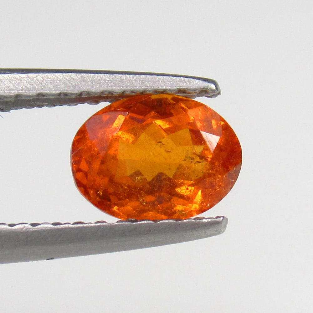 Natural Spessarite Garnet - 1.06 Ct: No Reserve! Title: Natural Spessarite Garnet - 1.06 Ct Origin: Madagascar Weight:1.06 Size/Dimensions: 14.0 x 10.0 x 5.5 mm Description: Pieces : 1 No's / Shape : Oval Cut / Color : Orange / Clarity :