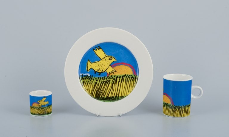 Corneille (guillaume Cornelis Van Beverloo), Dutch Cobra Artist (1922-2010). Coffee Cup, Plate, And: Corneille (Guillaume Cornelis van Beverloo), Dutch CoBrA artist (1922-2010). Coffee cup, plate, and egg cup in porcelain decorated with birds over a field with sunrise. From the 1980s/90s. In perfect
