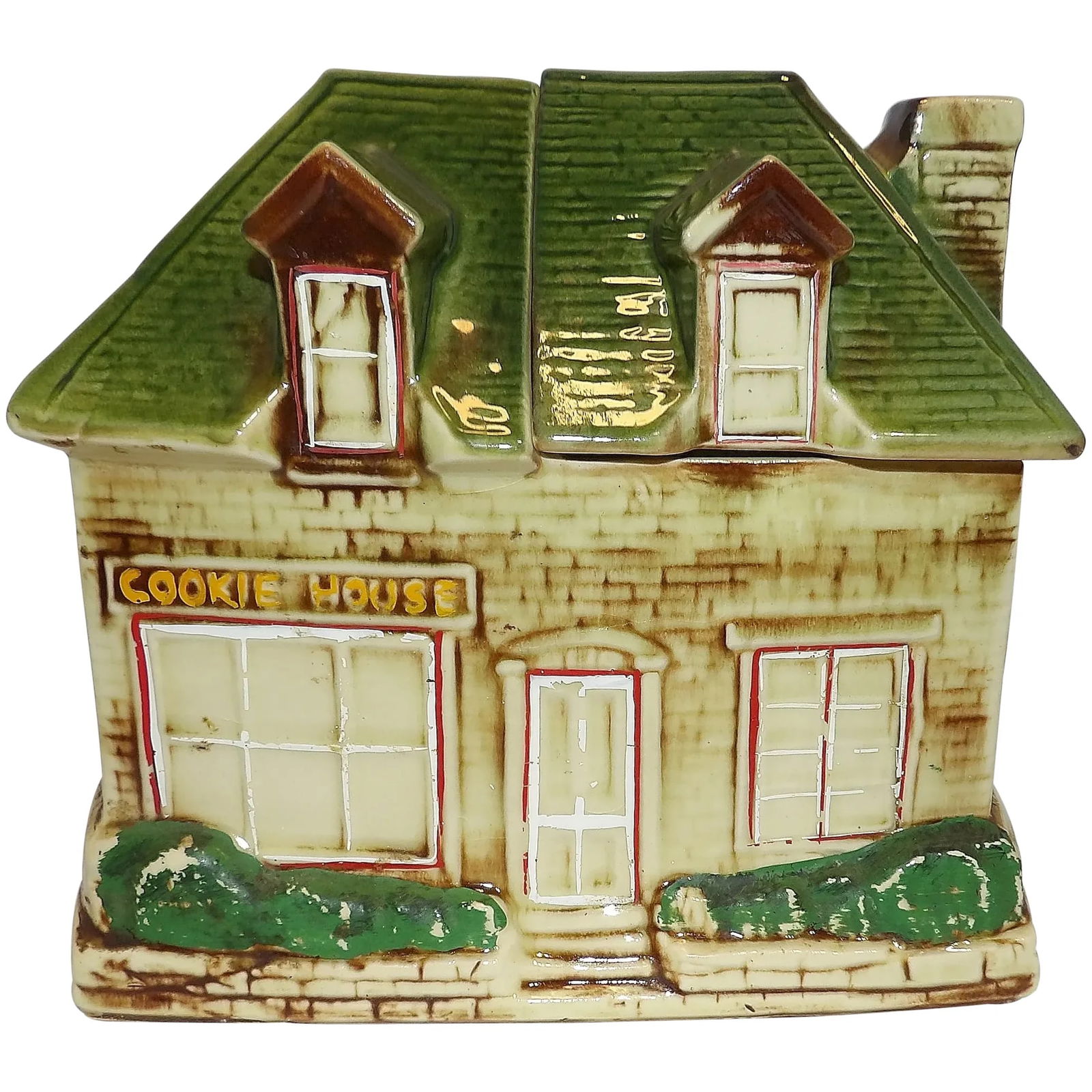 Vintage 1950’s McCoy Cookie House Cookie Jar: This Vintage 1950’s McCoy Cookie House Cookie Jar is in good condition. It does have wear to paint as is expected with cold painted cookie jars and it does have a crack on the backside of the ro
