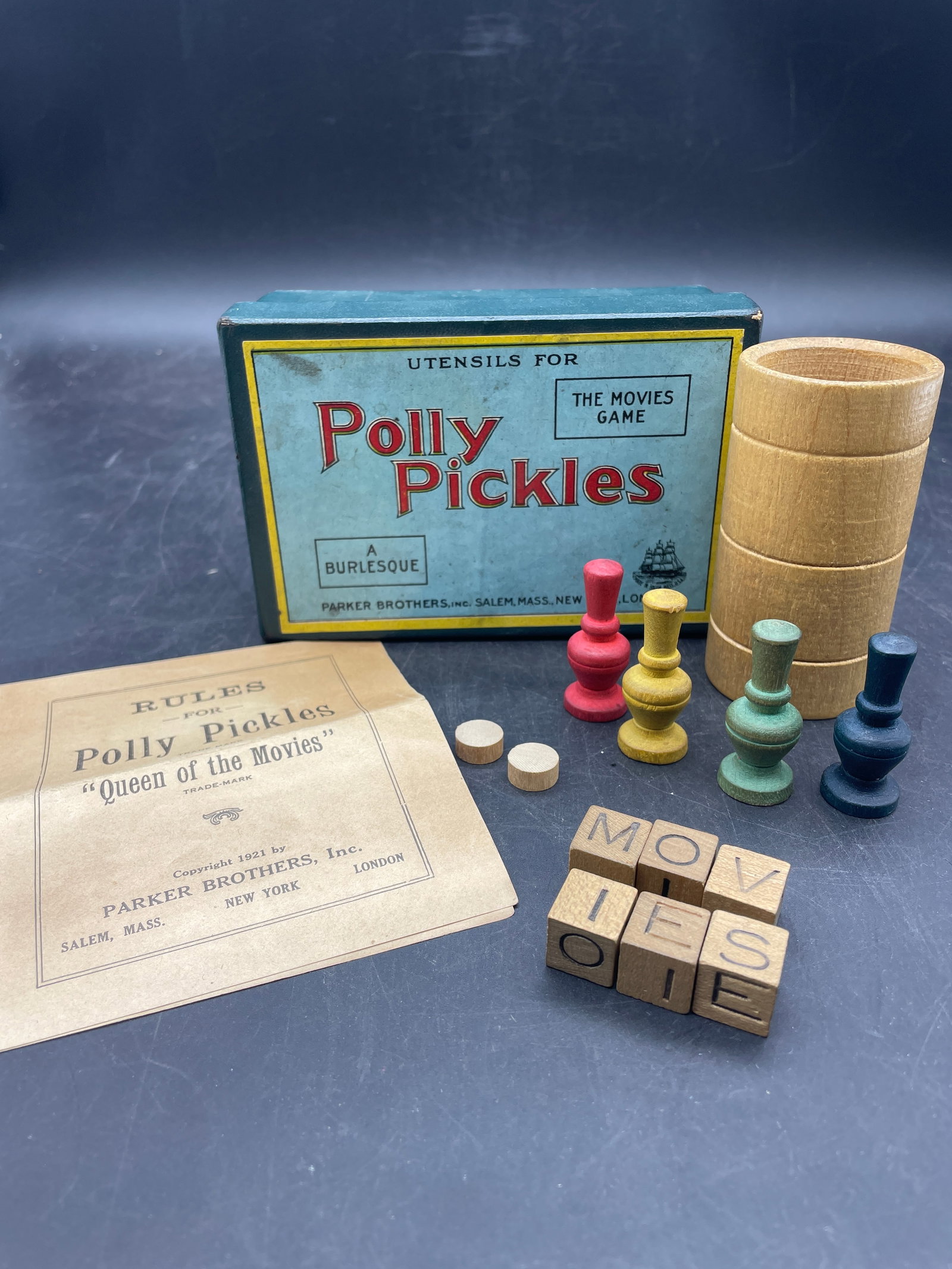 RARE VINTAGE 1921 PARKER BROTHERS POLLY PICKLES THE MOVIES GAME PIECES: Title: RARE VINTAGE 1921 PARKER BROTHERS POLLY PICKLES THE MOVIES GAME PIECES Date/Period: APPROX 1920'S Dimension: NA Material: MIXED MATERIALS Additional Information: RARE VINTAGE 1921 PARKER BROTHE