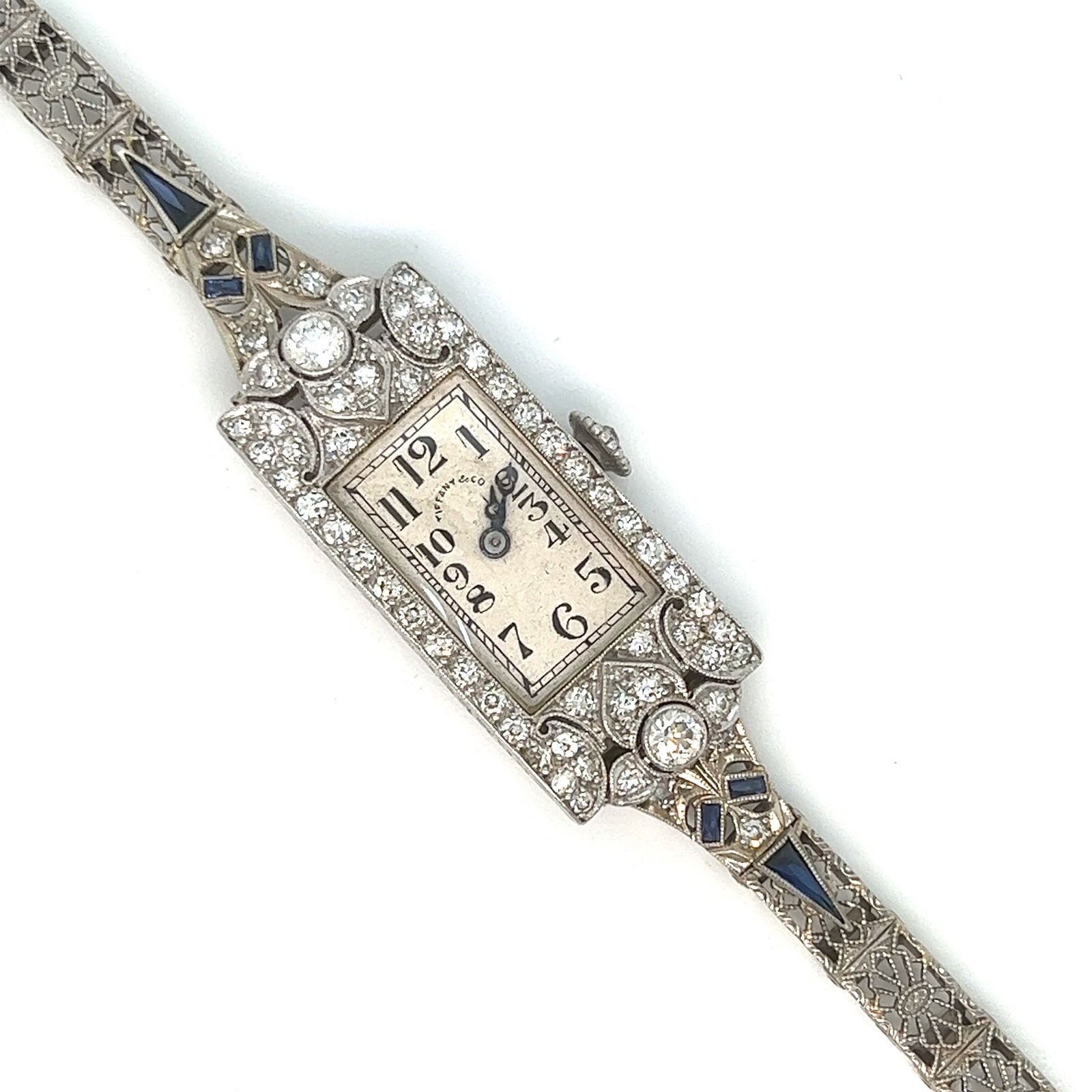 Antique Art Deco Tiffany & Co Platinum Diamond Watch: Vintage from the 1920s Band material: White gold Materials: Platinum Power: Mechanical Readout: Analog Style: Art deco Antique Platinum diamond watch from the art deco period Band is solid 14 karat