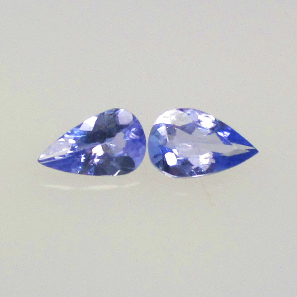 0.43 Ctw Natural Tanzanite Pear Pair: No Reserve! Title: 0.43 Ctw Natural Tanzanite Pear Pair Stone Clarity: VVS Gemstone:Natural Tanzanite Carat Weight: 0.43 Size/Dimensions: 5.20 x 3.20 x 2.20 mm / 2 Pc's Additional Info:Top Quality Lus