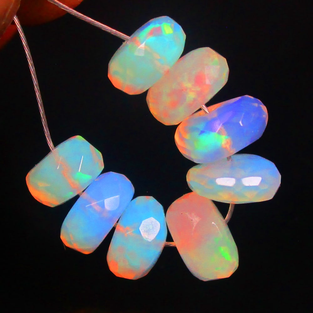 4.08 Ctw Natural 8 Ethiopian Drilled Faceted Fire Opal Beads: No Reserve! Title: 4.08 Ctw Natural 8 Ethiopian Drilled Faceted Fire Opal Beads Stone Clarity: Transparent Gemstone:Natural Faceted Fire Opal Beads Carat Weights: 4.08 Size/Dimensions: 5.00 to 6.10 mm