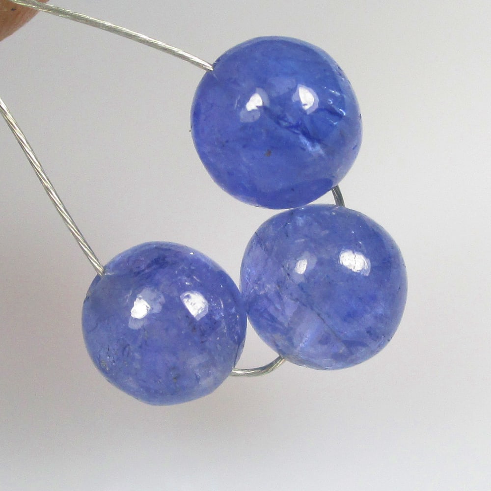 5.42 Ctw Natural 3 Tanzanite Round Beads: No Reserve! Title: 5.42 Ctw Natural 3 Tanzanite Round Beads Stone Clarity: Transparent Gemstone:Natural Tanzanite Carat Weights: 5.42 Size/Dimensions: 5.90 - 6.10 mm / 3 PC's Additional Info:Round Bea
