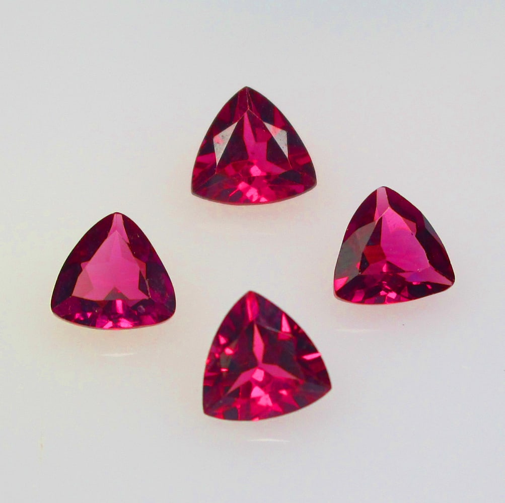2.12 Ctw Natural Rhodolite Garnet Trillion Set: No Reserve! Title: 2.12 Ctw Natural Rhodolite Garnet Trillion Set Stone Clarity: VVS Gemstone:Natural Rhodolite Garnet Carat Weight: 2.12 Size/Dimensions: 5.1x2.4 - 5.4x3.0 mm / 4 Pc's Additional Info
