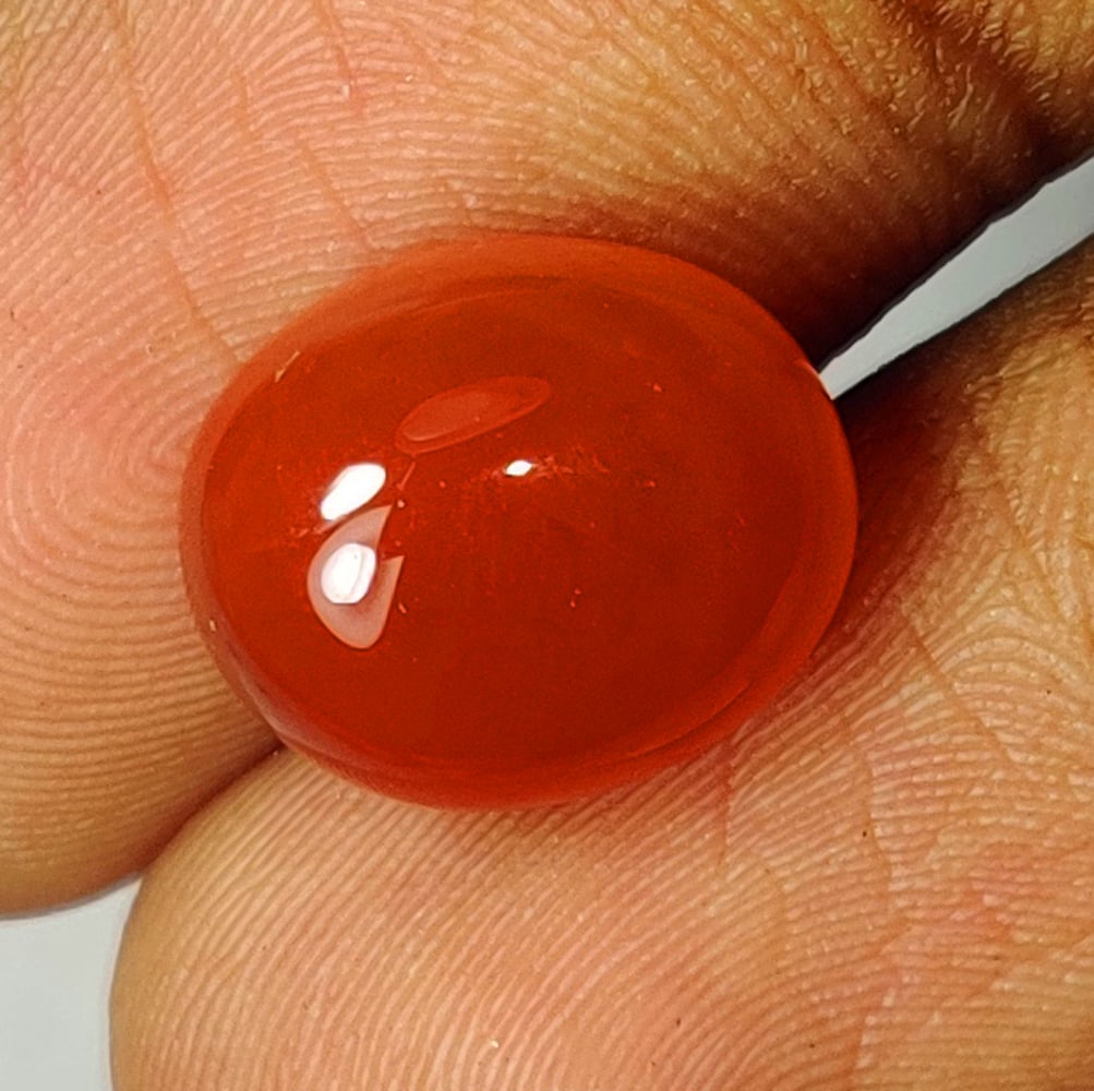 6.34 Ctw Natural Orange Carnelian Oval Cab: No Reserve! Title: 6.34 Ctw Natural Orange Carnelian Oval Cab Stone Clarity: Opaque Gemstone:Natural Carnelian Carat Weights: 6.34 Size/Dimensions: 12.10 x 10.10 x 6.40 mm Additional Info:Oval Cab / O