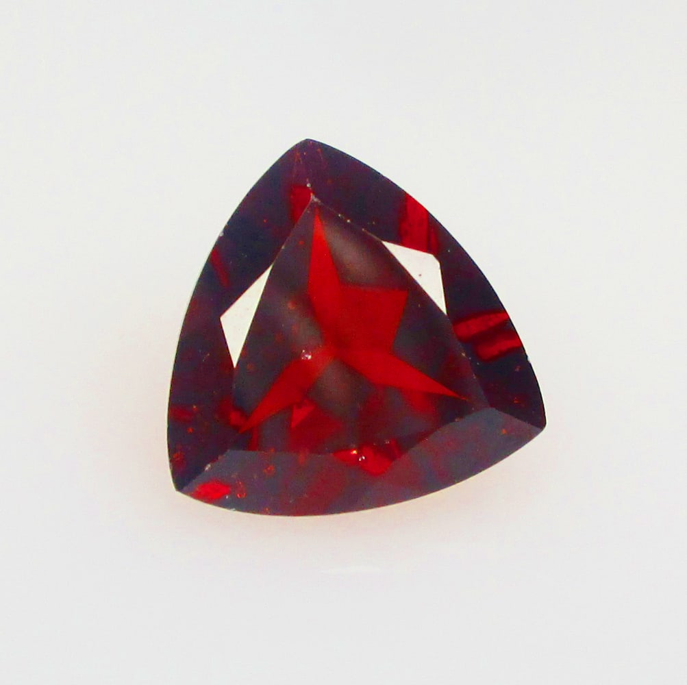3.82 Ctw Natural Rhodolite Garnet Trillion Cut: No Reserve! Title: 3.82 Ctw Natural Rhodolite Garnet Trillion Cut Stone Clarity: VVS Gemstone:Natural Rhodolite Garnet Carat Weights: 3.82 Size/Dimensions: 10.30 x 10.20 x 5.50 mm Additional Info:Purp
